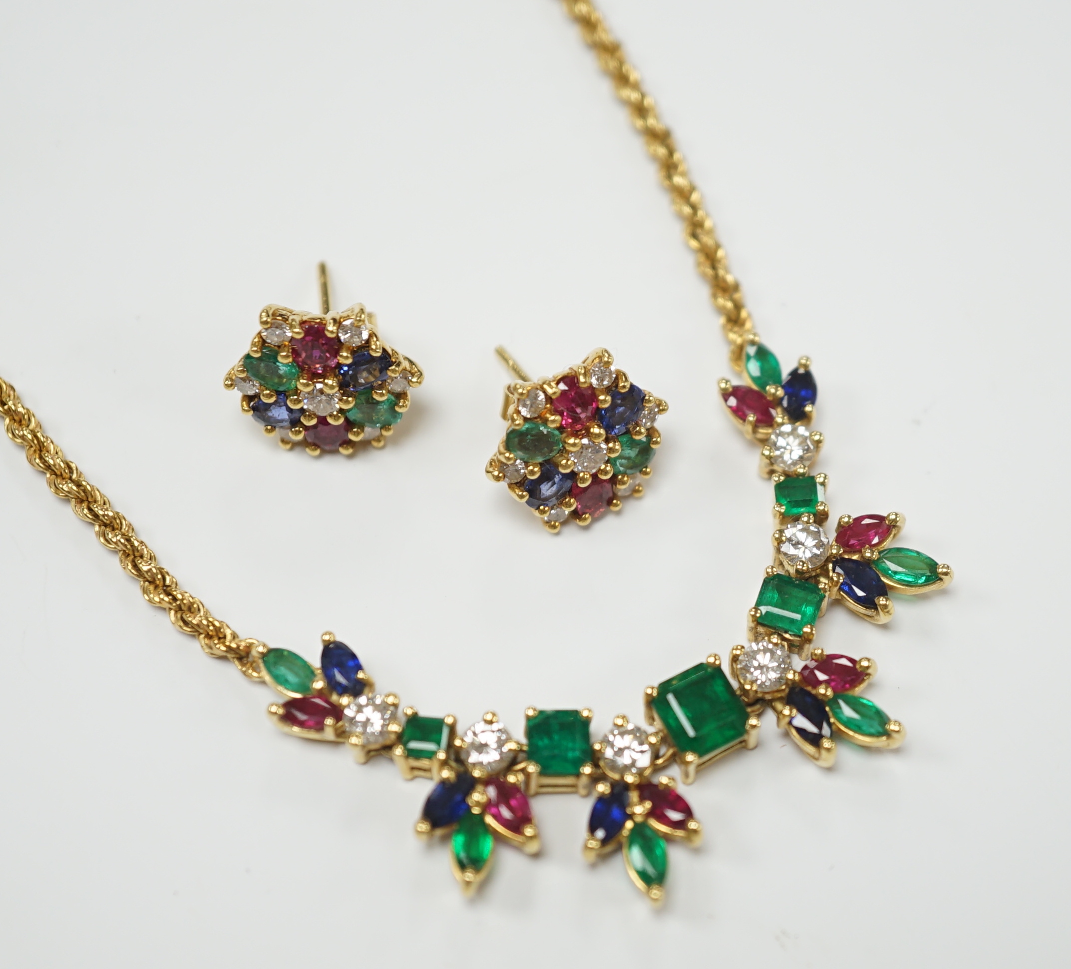 A 1960's? yellow metal, ruby, sapphire, emerald and diamond cluster set 'tutti fruiti' necklace, 44cm and pair of matching ear studs, the butterflies stamped 750